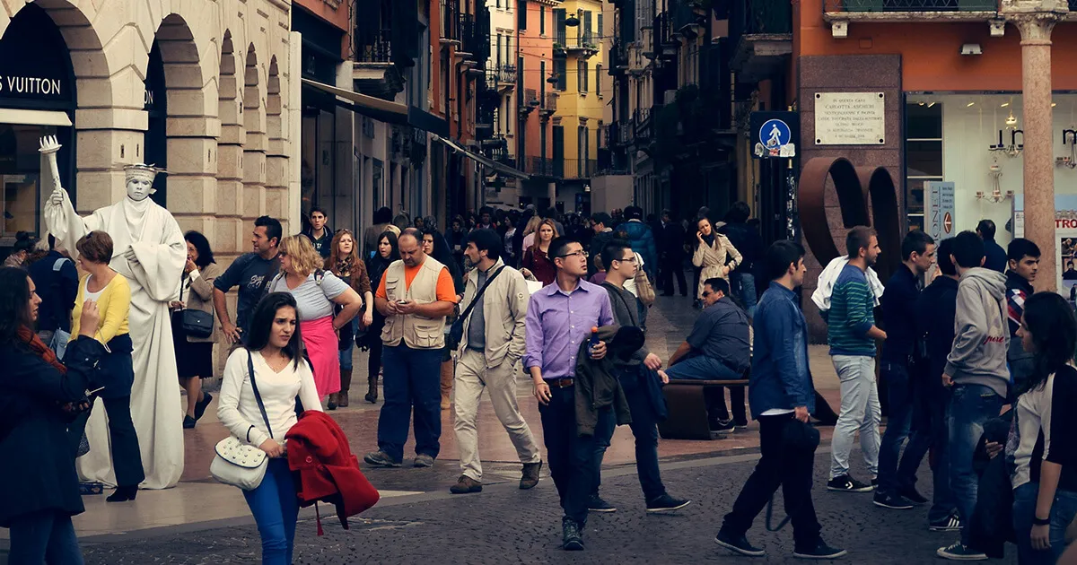 An Italian street scene with a tabaccheria, post office and busy daily life